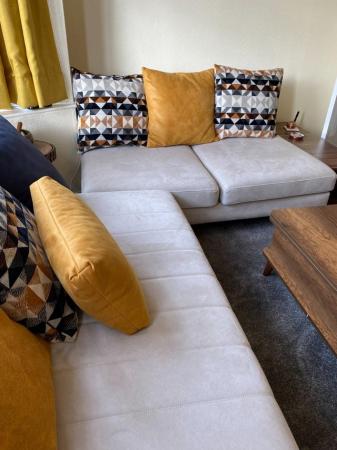 Image 1 of 8 seater Designer sofa + in between wooden table