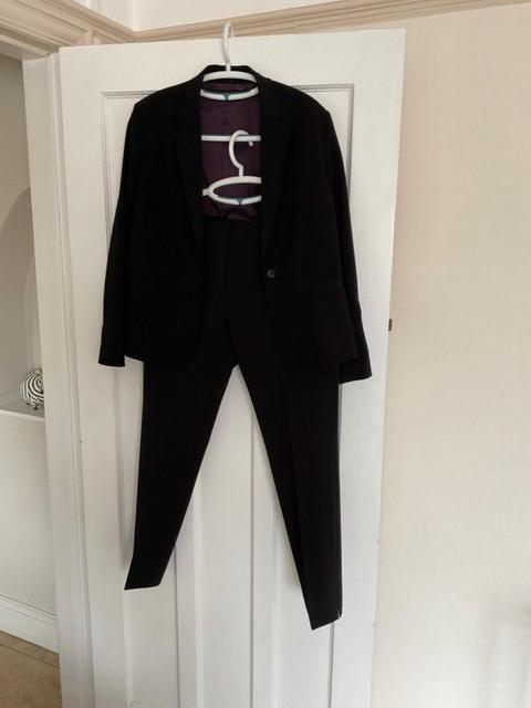 Preview of the first image of Jigsaw black ladies trouser suit.