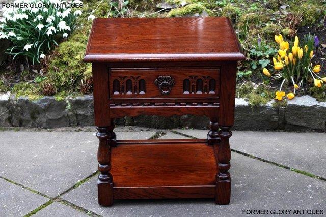 Preview of the first image of AN OLD CHARM TUDOR BROWN CARVED OAK BEDSIDE PHONE LAMP TABLE.