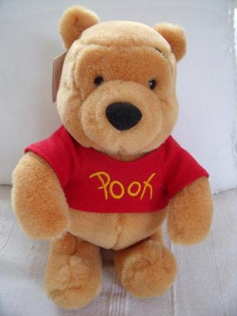 Image 1 of 10" Winne The Pooh sitting soft toy/Disneyland, Paris + tag.