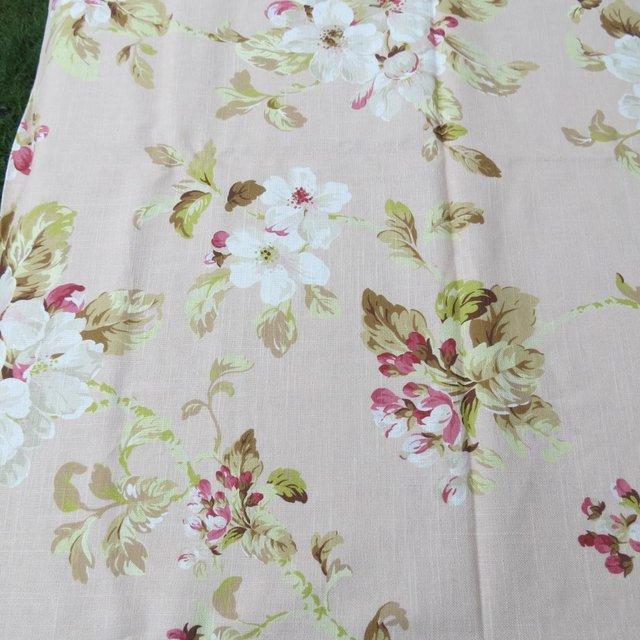 Preview of the first image of Fabric Remnant  soft pink background with floral design.