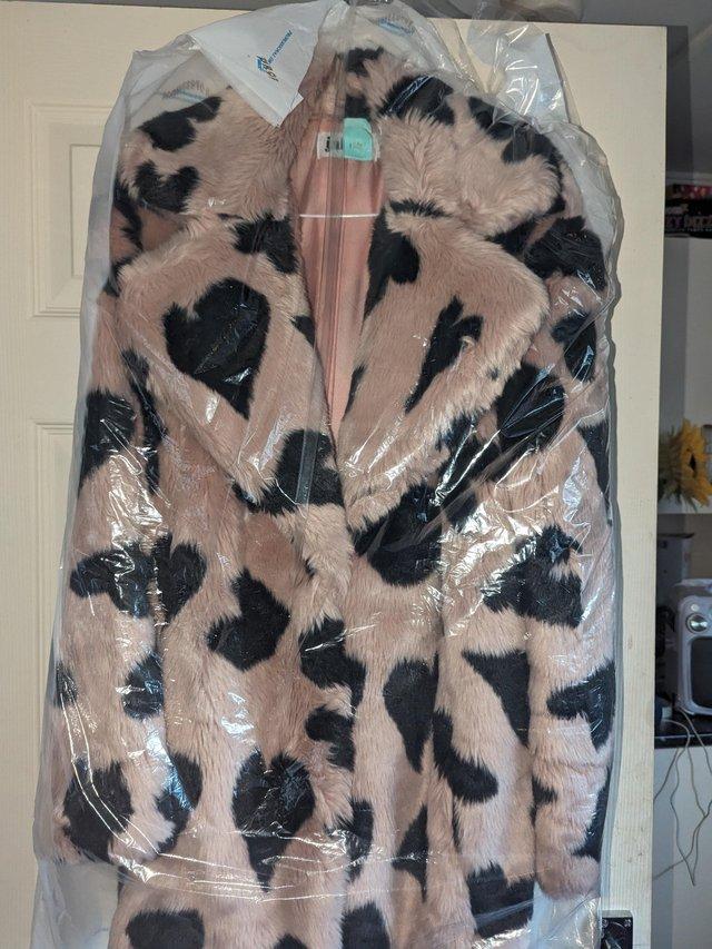 Preview of the first image of Rose gold fur heart coat.