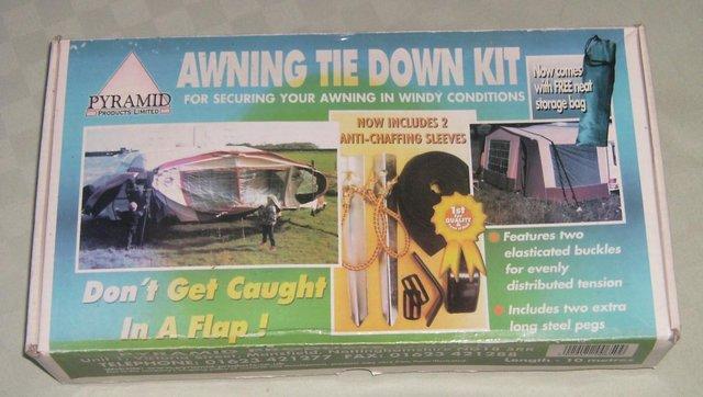 Preview of the first image of Awning Tie Down Kit - unused in box.