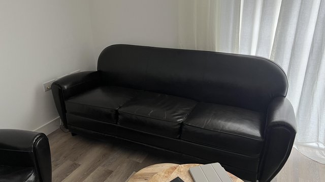 Image 1 of Real leather vintage style sofa in black.