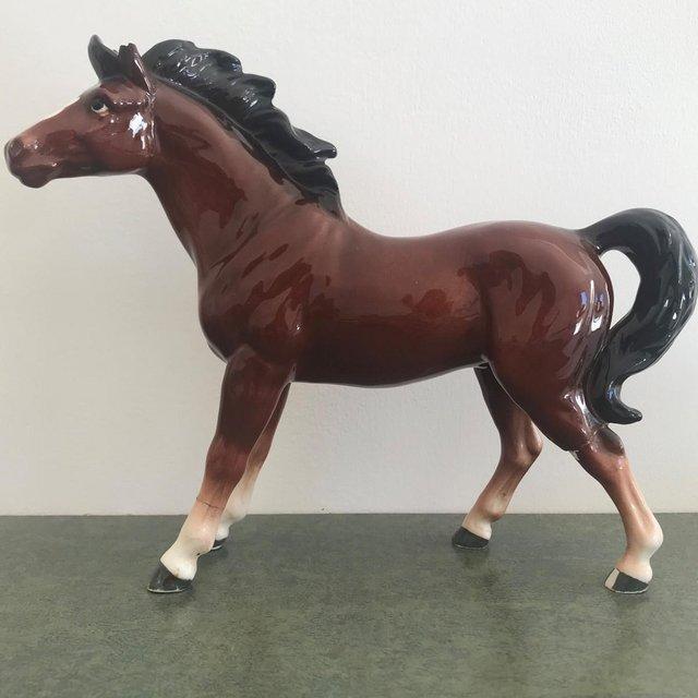 Preview of the first image of Vintage 1960/70's brown ceramic horse - damage, repairs..