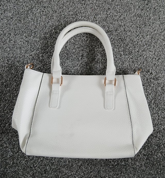 Preview of the first image of George ladies white handbag.