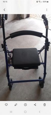 Image 1 of Blue four wheel Rollator with seat