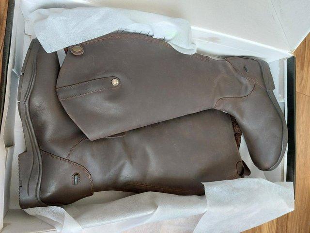 Preview of the first image of Mark Todd brown fleece lined riding boots 7 wide.