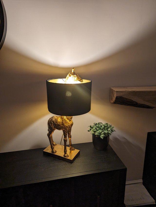 Preview of the first image of Gold giraffe lamp black shade.