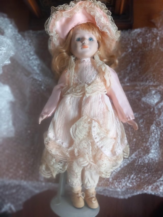 Preview of the first image of 14 porcelain dolls..Assorted sizes and types.