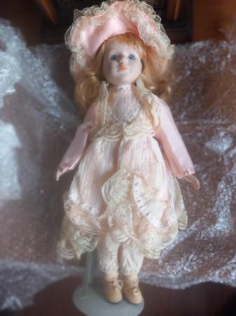 Image 1 of 14 porcelain dolls..Assorted sizes and types