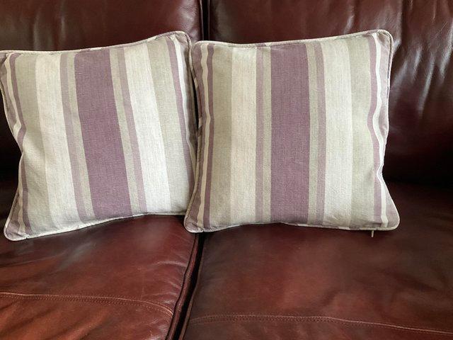 Preview of the first image of Two Laura Ashley cushions in amethyst.