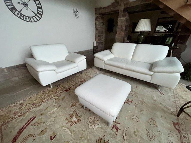 Preview of the first image of White leather sofa and matching armchair.