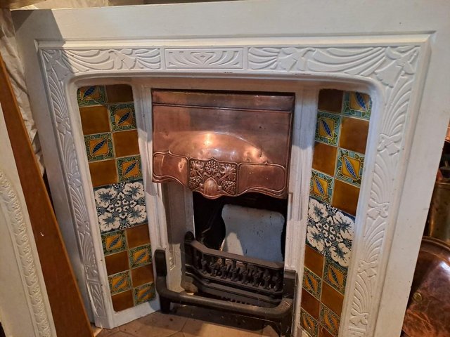 Preview of the first image of Genuine Antique Cast Iron Fireplace Insert with Copper Hood.