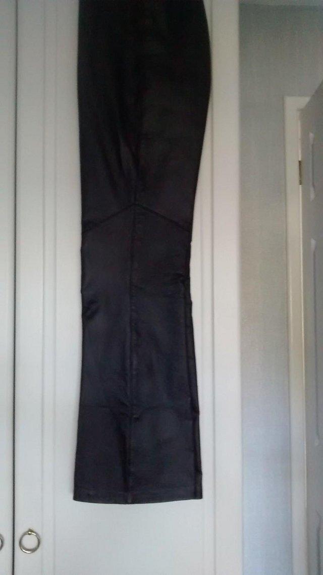 Preview of the first image of 100% Genuine leather dark brown trousers..
