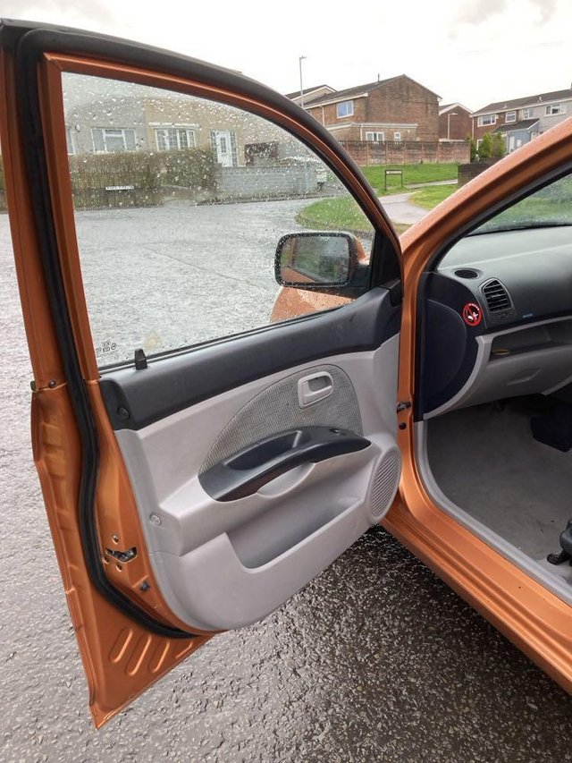 Preview of the first image of Kia Picanto 2005 1.1, Lovely little car, Orange, low miles.