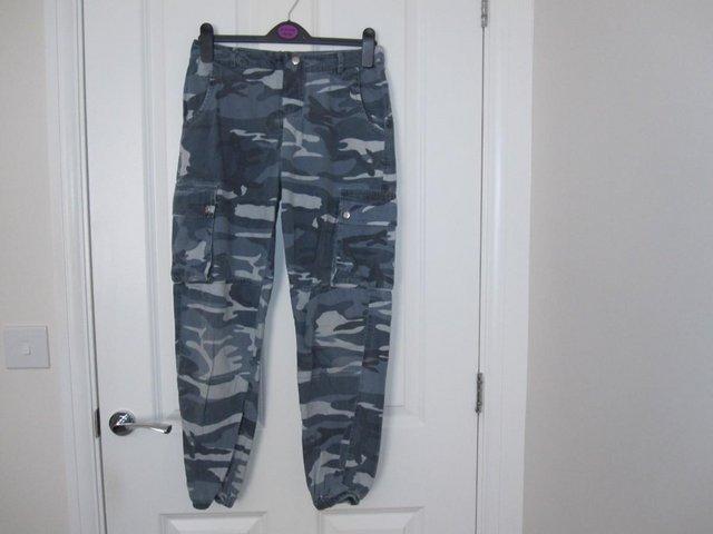 Preview of the first image of Teenage/girls camo trousers from New look.