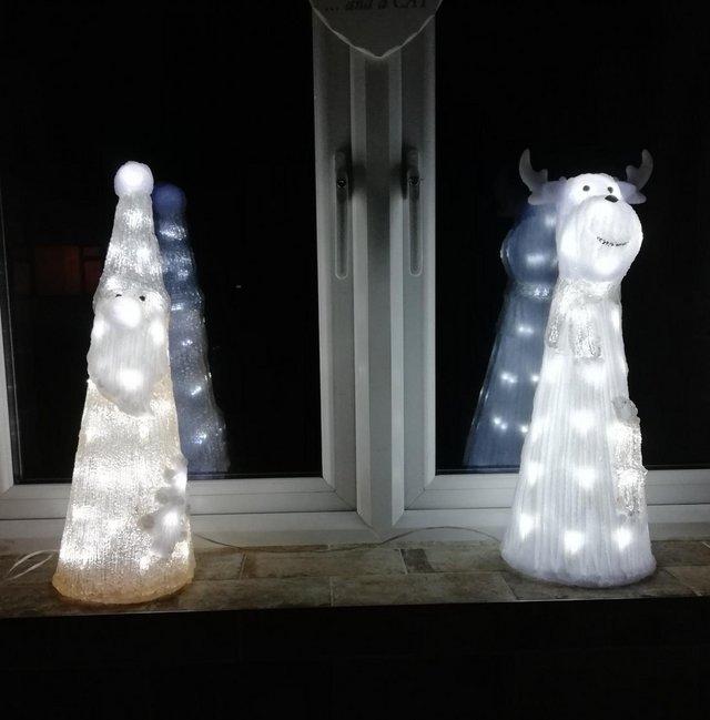 Preview of the first image of 2 X light up christmas ornaments.