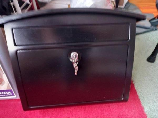 Image 1 of Black safe made of metal with 2  keys