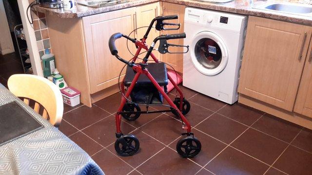 Preview of the first image of Red aluminium rollator for sale.