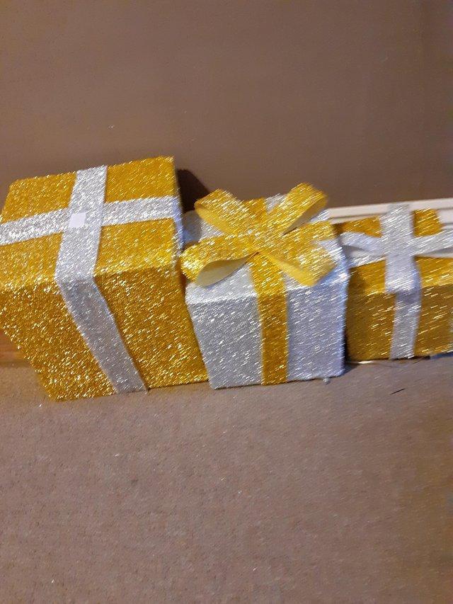 Preview of the first image of Glittered golden Christmas parcels i.
