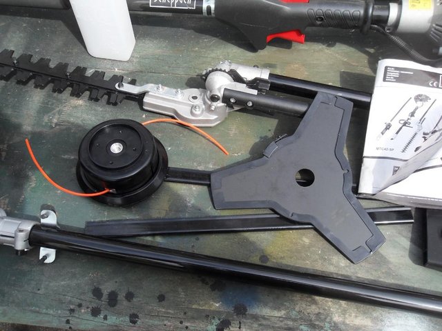 Preview of the first image of 4-in-1 Petrol Multi-Tool Hedge trimmer/Chainsaw/strimmer.