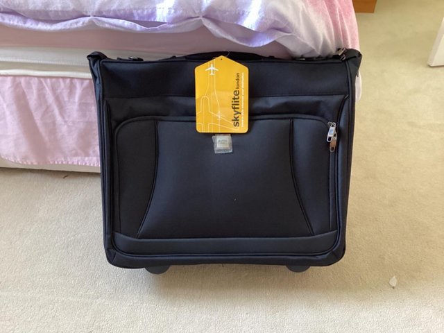 Preview of the first image of Black Trolley wardrobe bag.