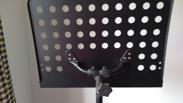 Preview of the first image of Robust height adjustable and collapsible music stand.
