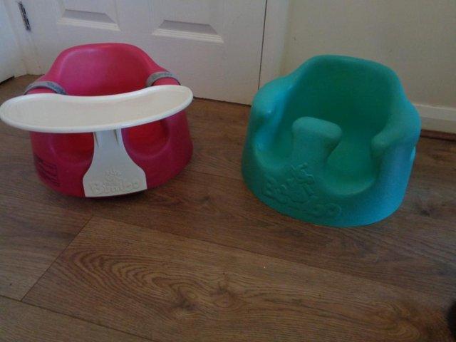 Preview of the first image of BUMBO child seats  one with table and straps.