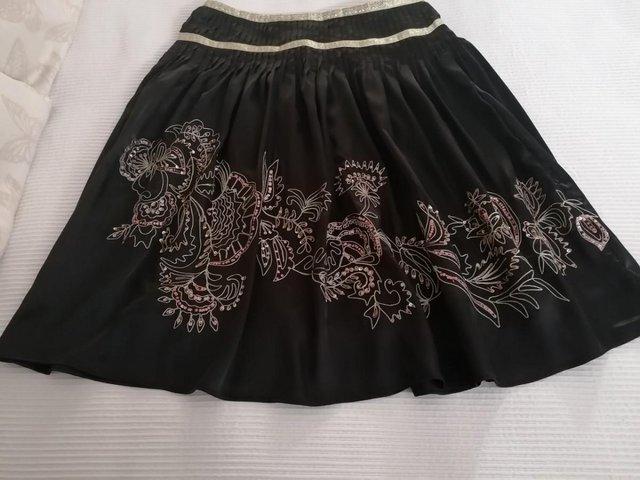 Preview of the first image of LADIES BLACK SILKY SKIRT 10 UK.