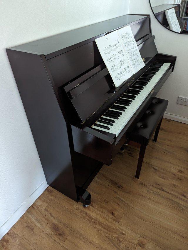 Preview of the first image of Waldstein upright piano with stool.
