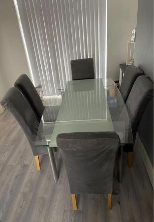 Image 1 of Glass extending table fits 10 -12 with 4 scroll chairs
