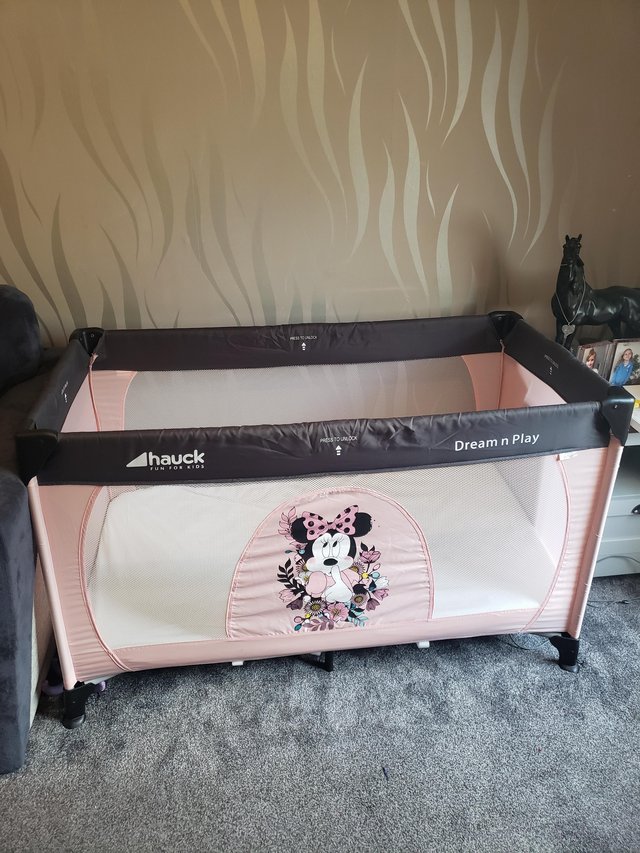 Preview of the first image of Minnie mouse travel cot/play pen.