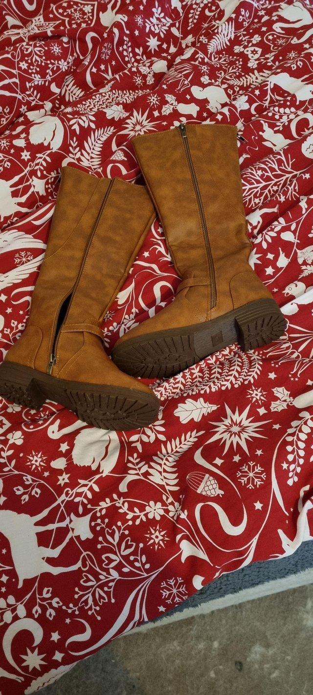 Preview of the first image of Brand New Brown Knee High boots Size 4.5.