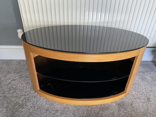 Preview of the first image of TV stand. Oval shape Oak and smoked glass.