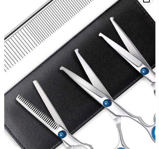 Preview of the first image of Pet grooming scissor set 4 piece.