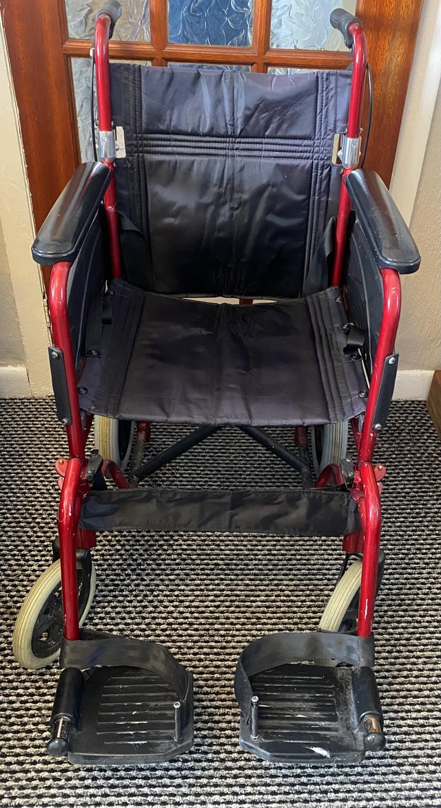 Preview of the first image of Red height adjustable wheelchair.