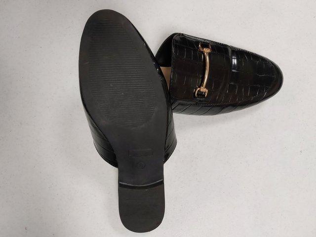 Preview of the first image of Boohoo flat black slip on sandals.
