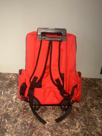 Image 2 of DOG CARRIER OR TROLLEY IN RED AND IS AS NEW CONDITION.