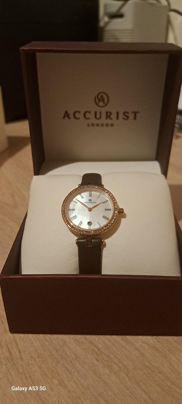 Preview of the first image of Stunning ladies watch with stone setting and pearl face.