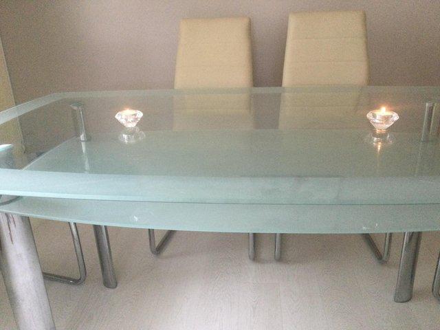 Preview of the first image of DOUBLE LAYER GLASS DINING TABLE.