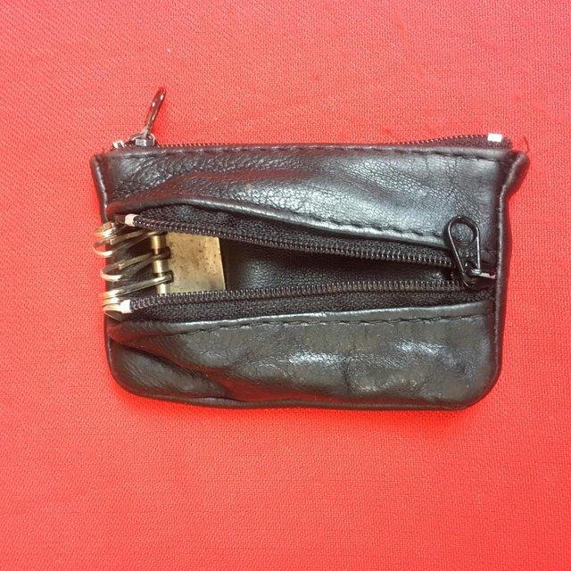 Preview of the first image of Vintage black leather coin/key purse.  Happy to post..