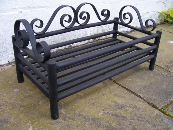 Image 1 of Log Fire Grate. Black with scroll metal work.