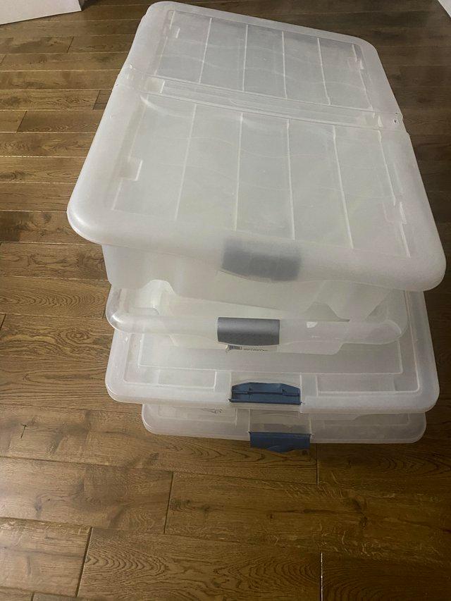 Preview of the first image of Plastic under bed storage boxes x4.