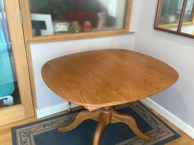 Preview of the first image of ERCOL CHESTER EXTENDING FING TABLE,NEVER EVER USED..