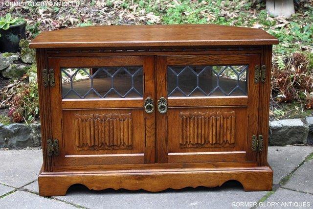 Preview of the first image of OLD CHARM LIGHT OAK CORNER TV CABINET MEDIA DVD STAND UNIT.