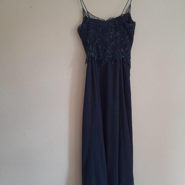 Preview of the first image of Navy beaded evening dress, size 12.