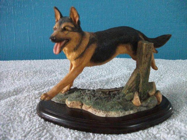 Preview of the first image of STUNNING JUMPING GERMAN SHEPHERD FIGURE SIGNED MOUNTED ON W.