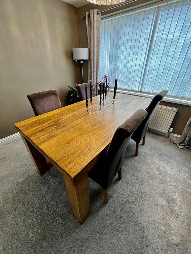 Preview of the first image of Solid mango wood table with 4 chairs.