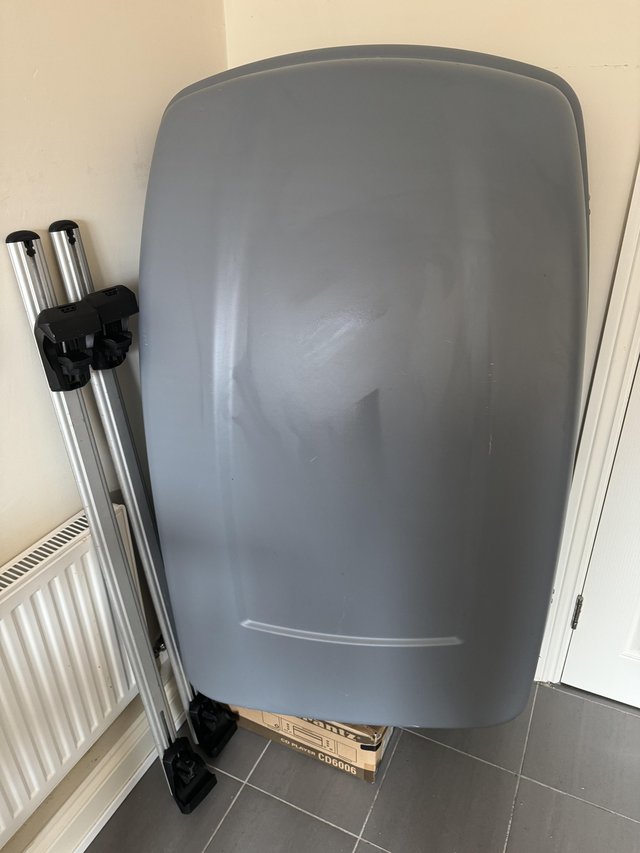 Preview of the first image of Halfords 320L roof box with aero bars 127cm and foot clamps.